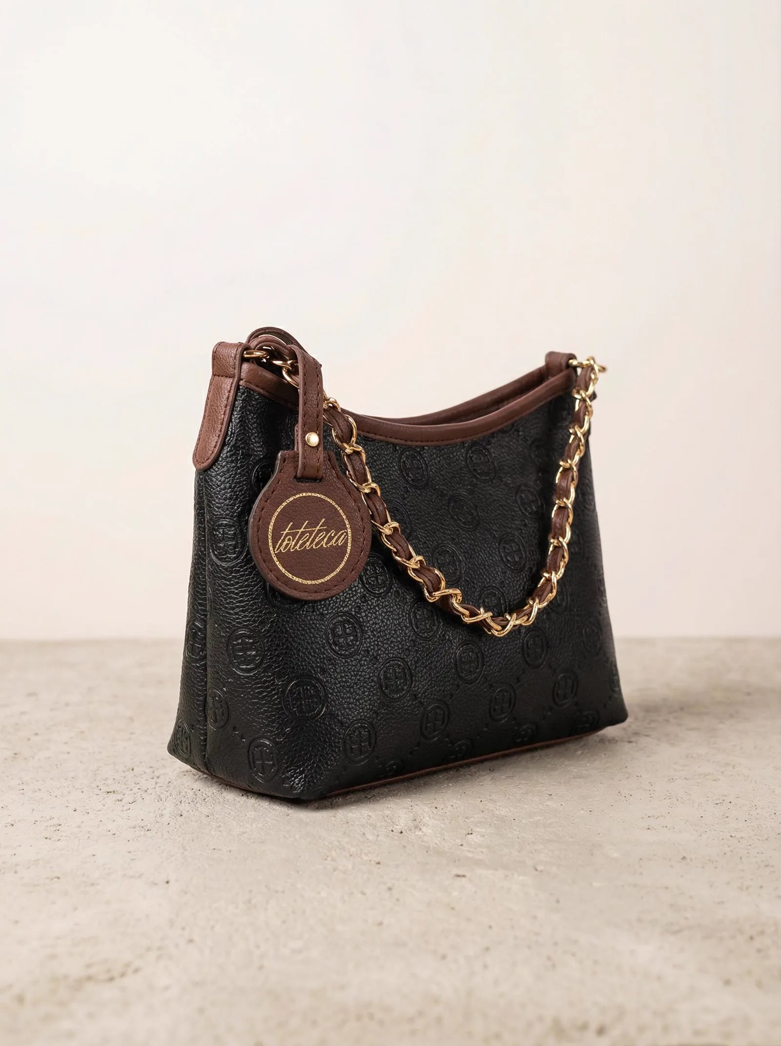 Black monogram Toteteca hobo bag with braided gold chain