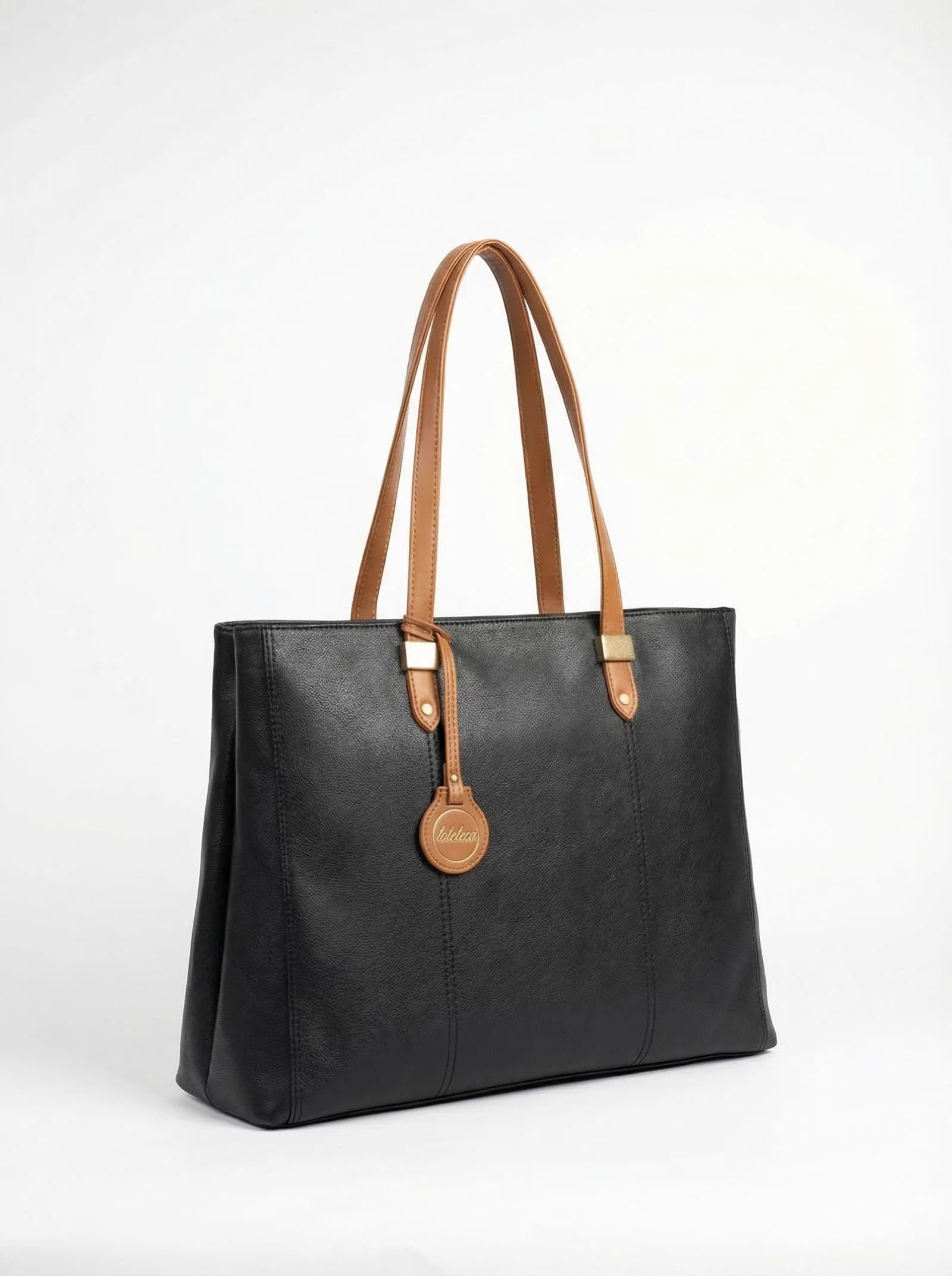 Black Toteteca tote with slim tan shoulder straps