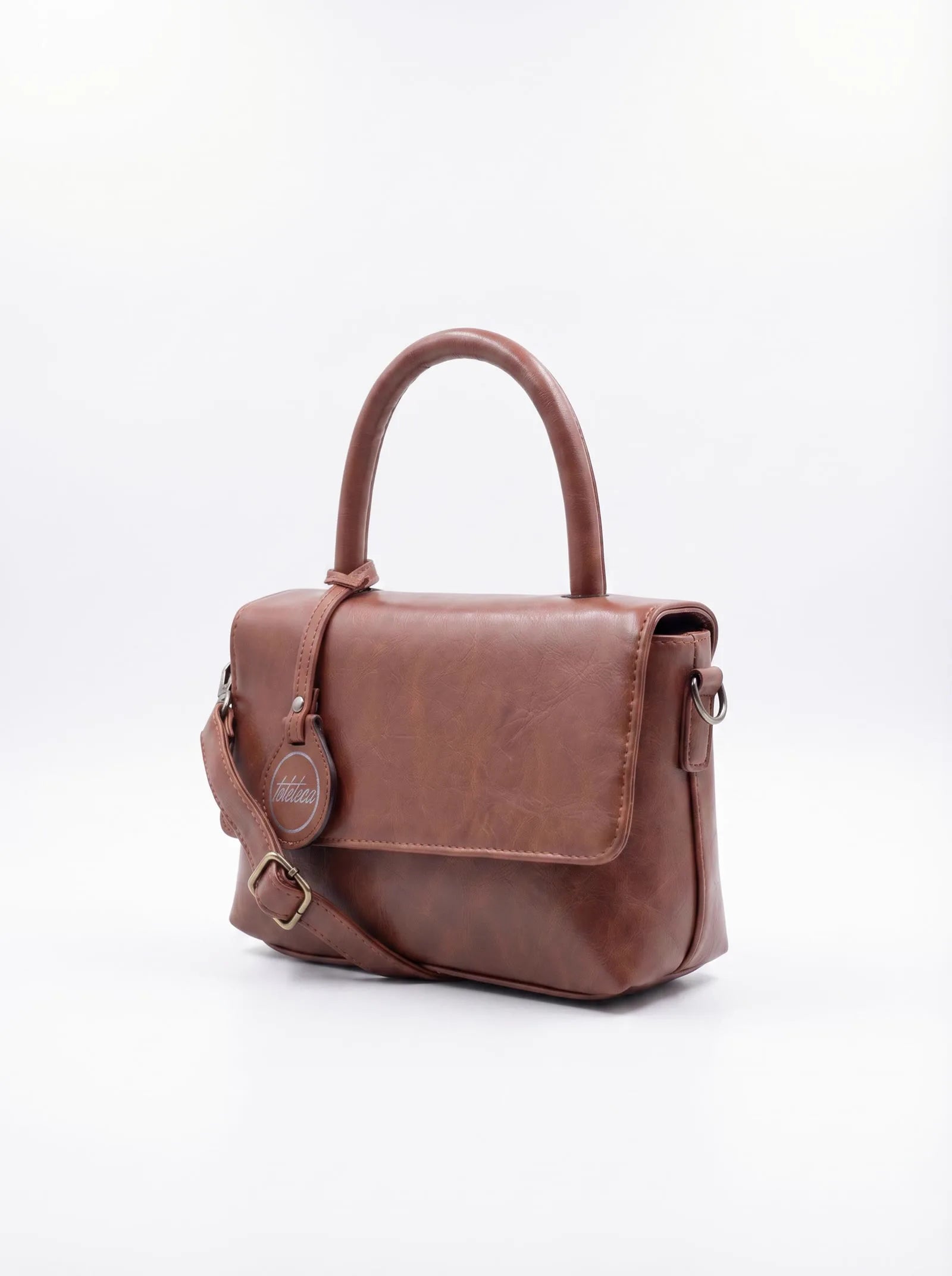 Rich brown Toteteca top-handle bag with logo charm