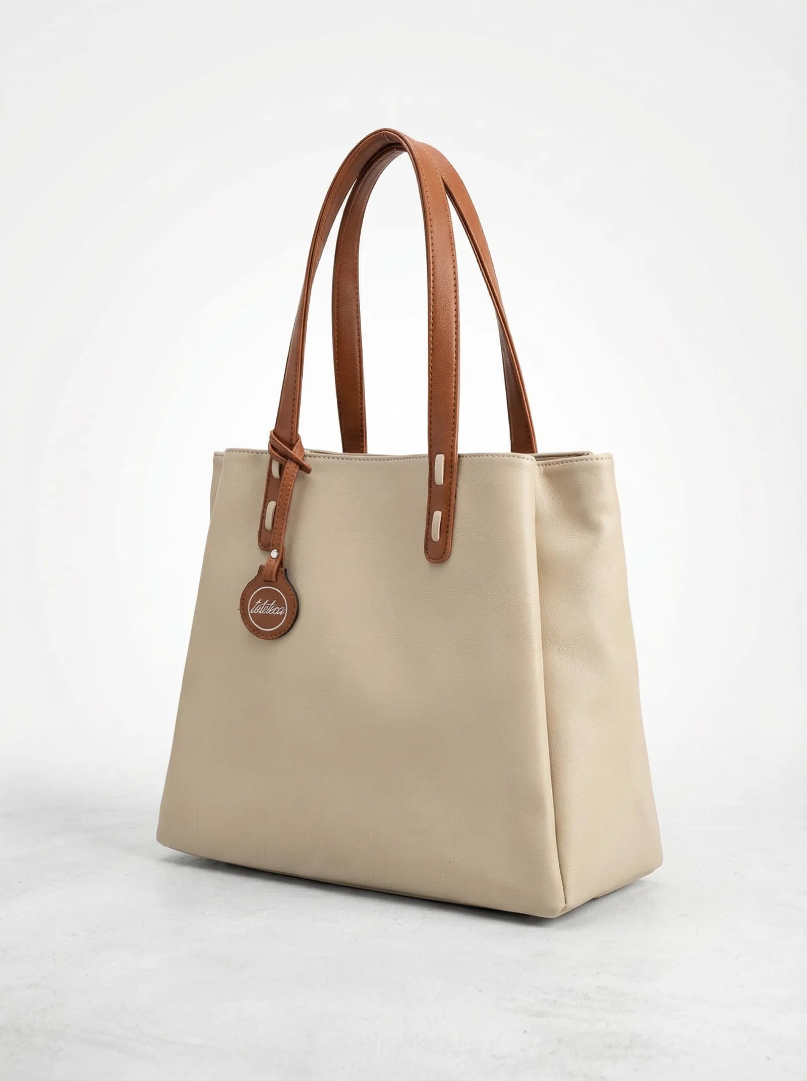 Off-white Toteteca tote with slim tan handles and logo charm