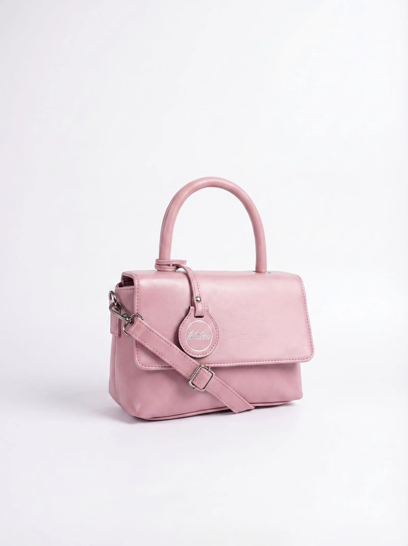 Blush pink Toteteca top-handle bag with crossbody strap